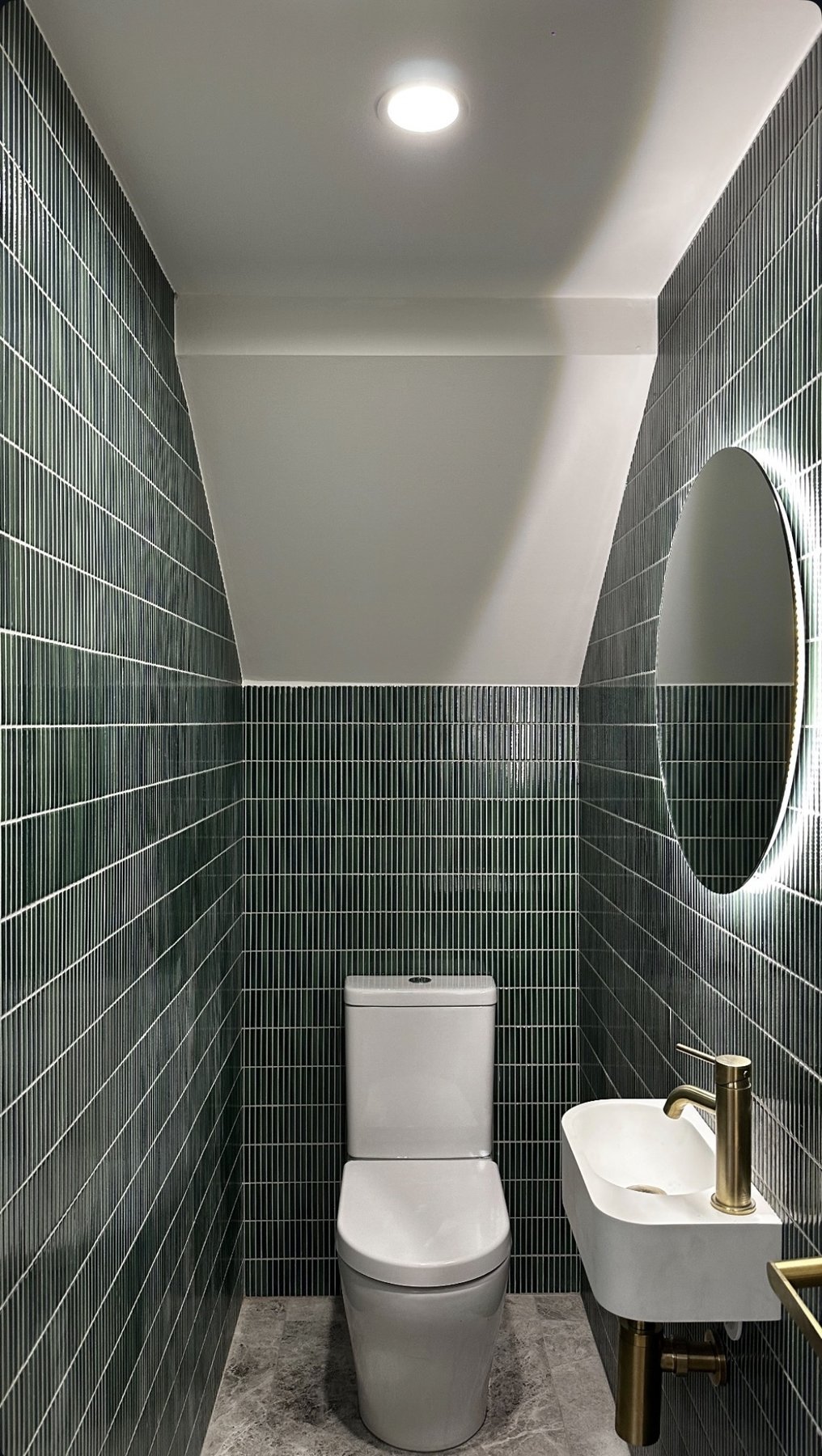 Deep green powder room with backlit mirror — Luxora Electrical